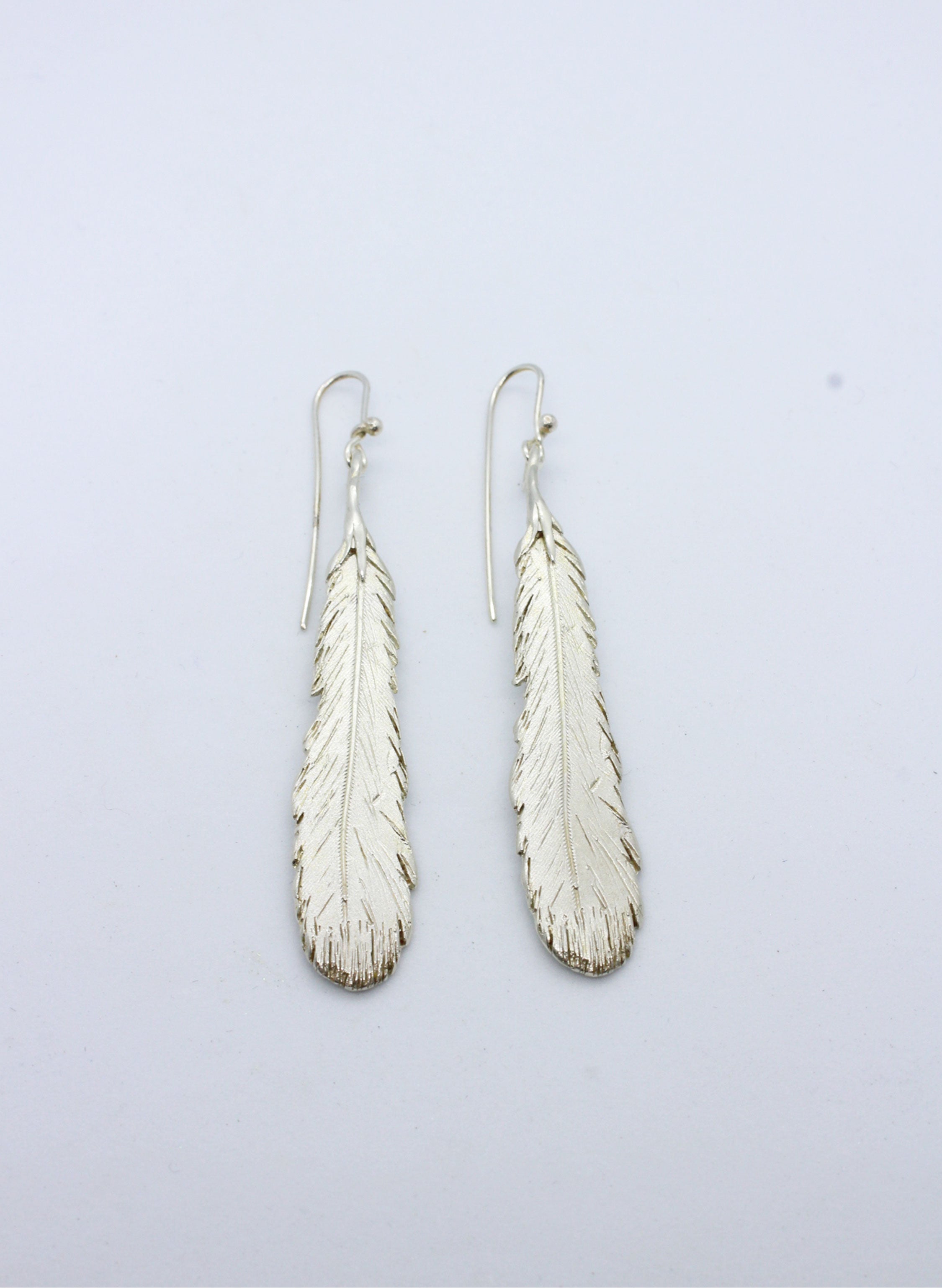 Huia shop feather earrings