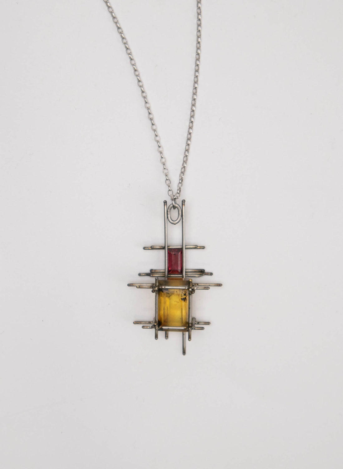 New Zealand Amber, Garnet and Titanium Pendant