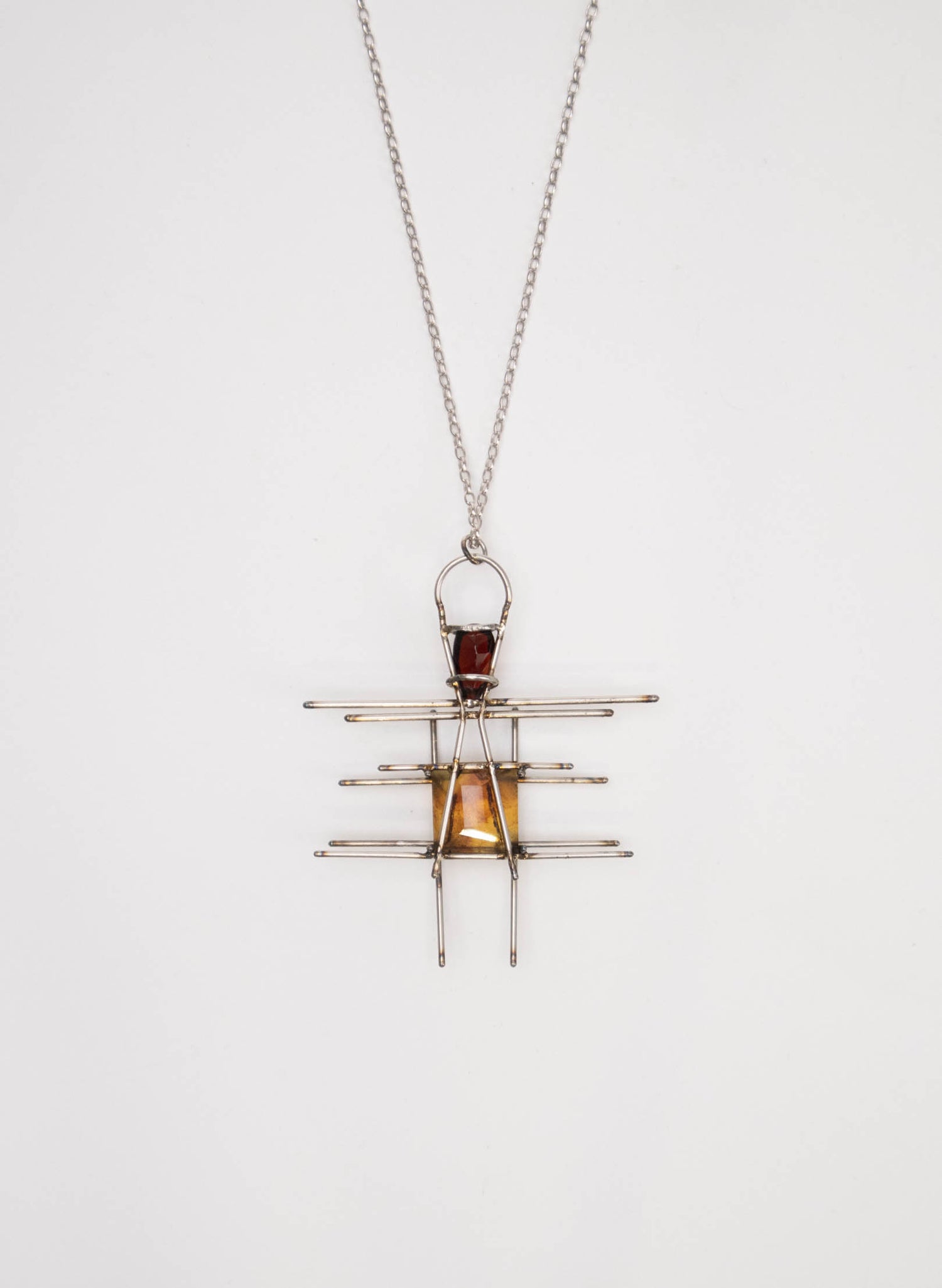 New Zealand Amber, Garnet and Titanium Pendant