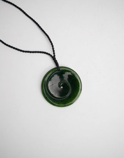 Carved Pounamu Disc Pendant