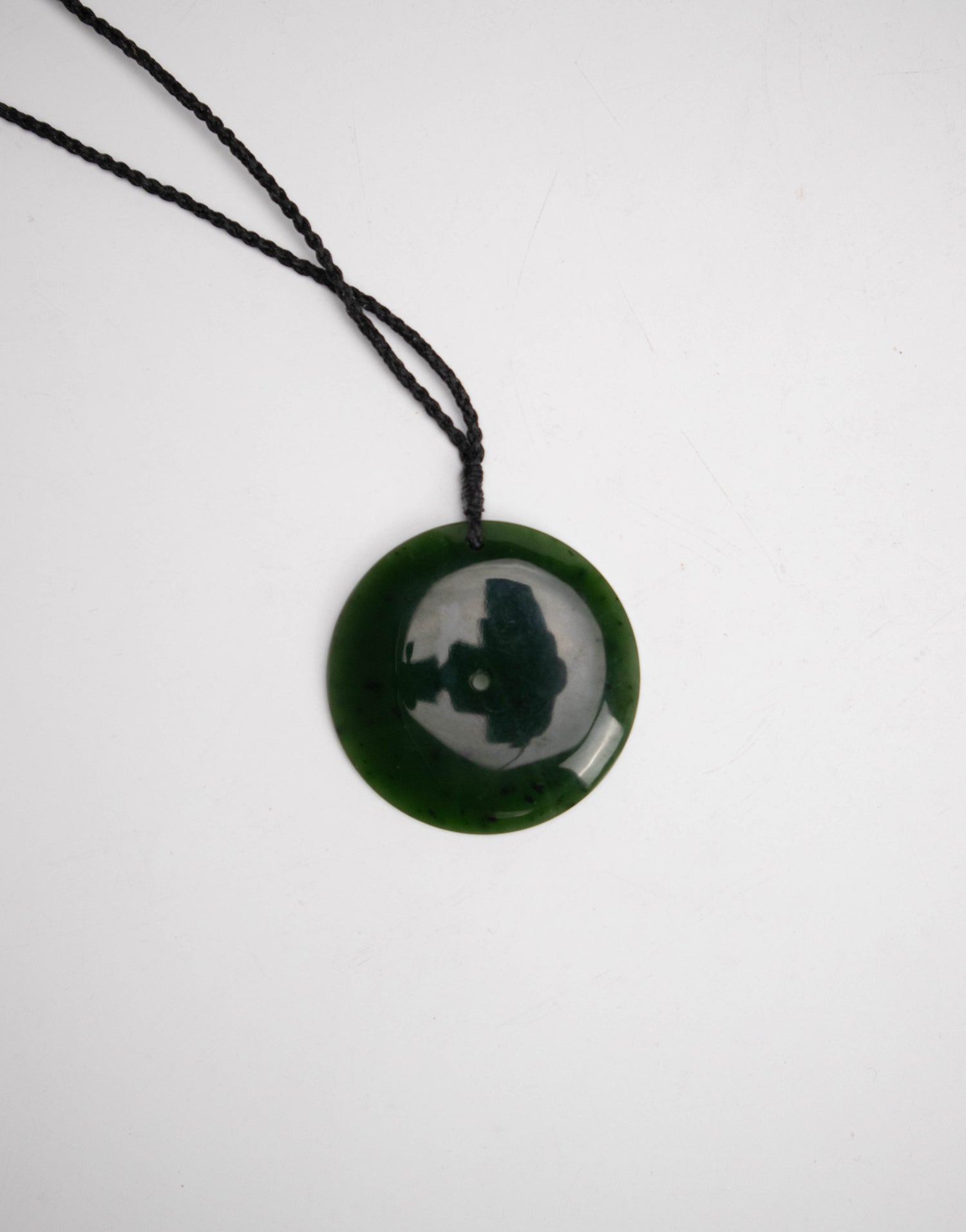 Carved Pounamu Disc Pendant